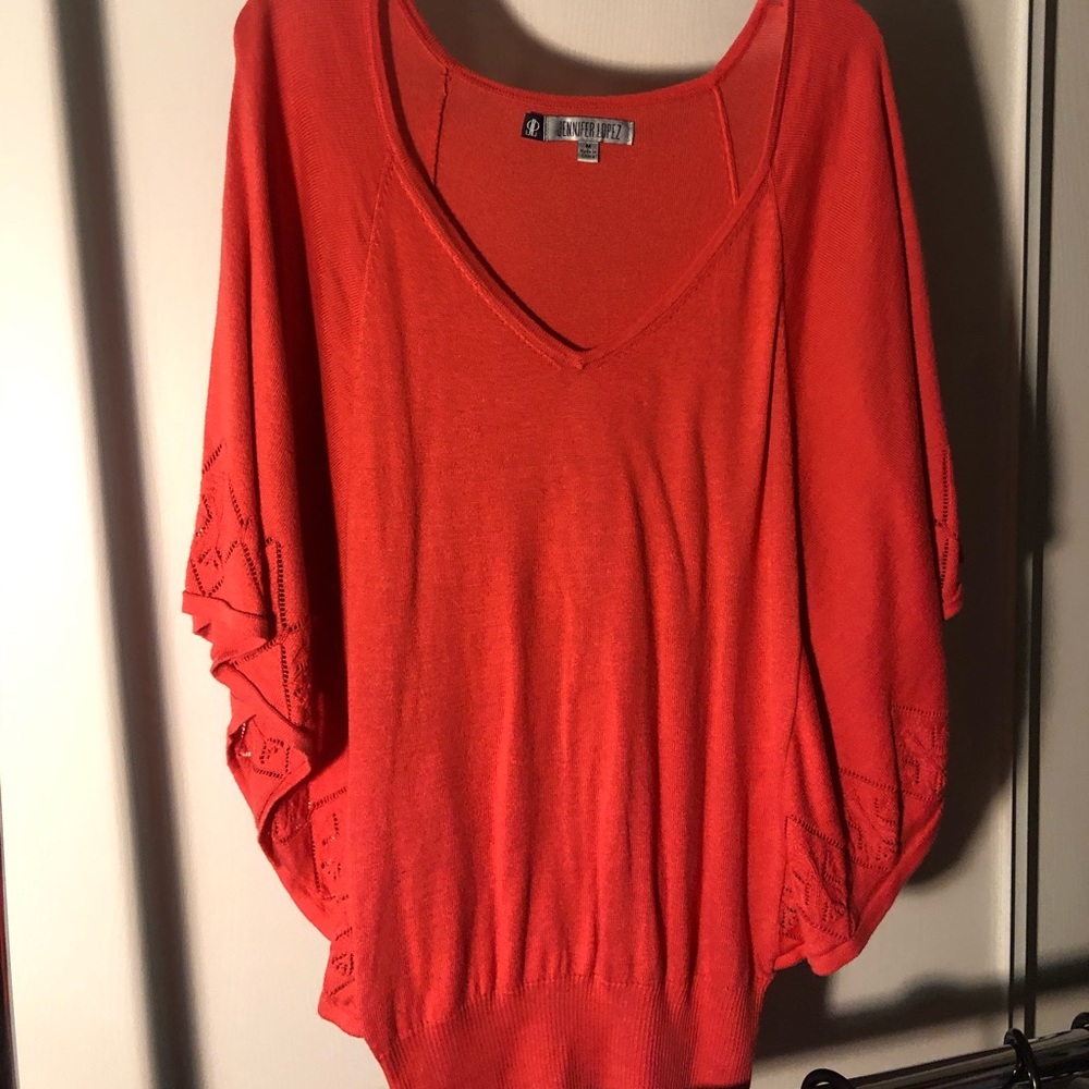 Jennifer Lopez, sweater/ shirt